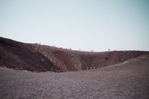 People walking on the top of an old caldera